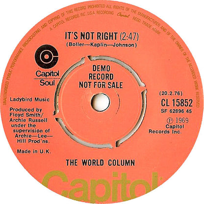 The World Column* : So Is The Sun (7", Single, Promo, RE)